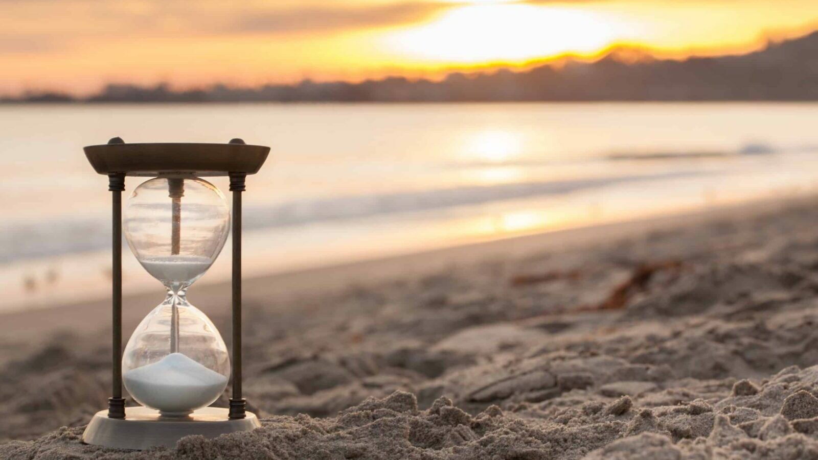 hourglass on beach